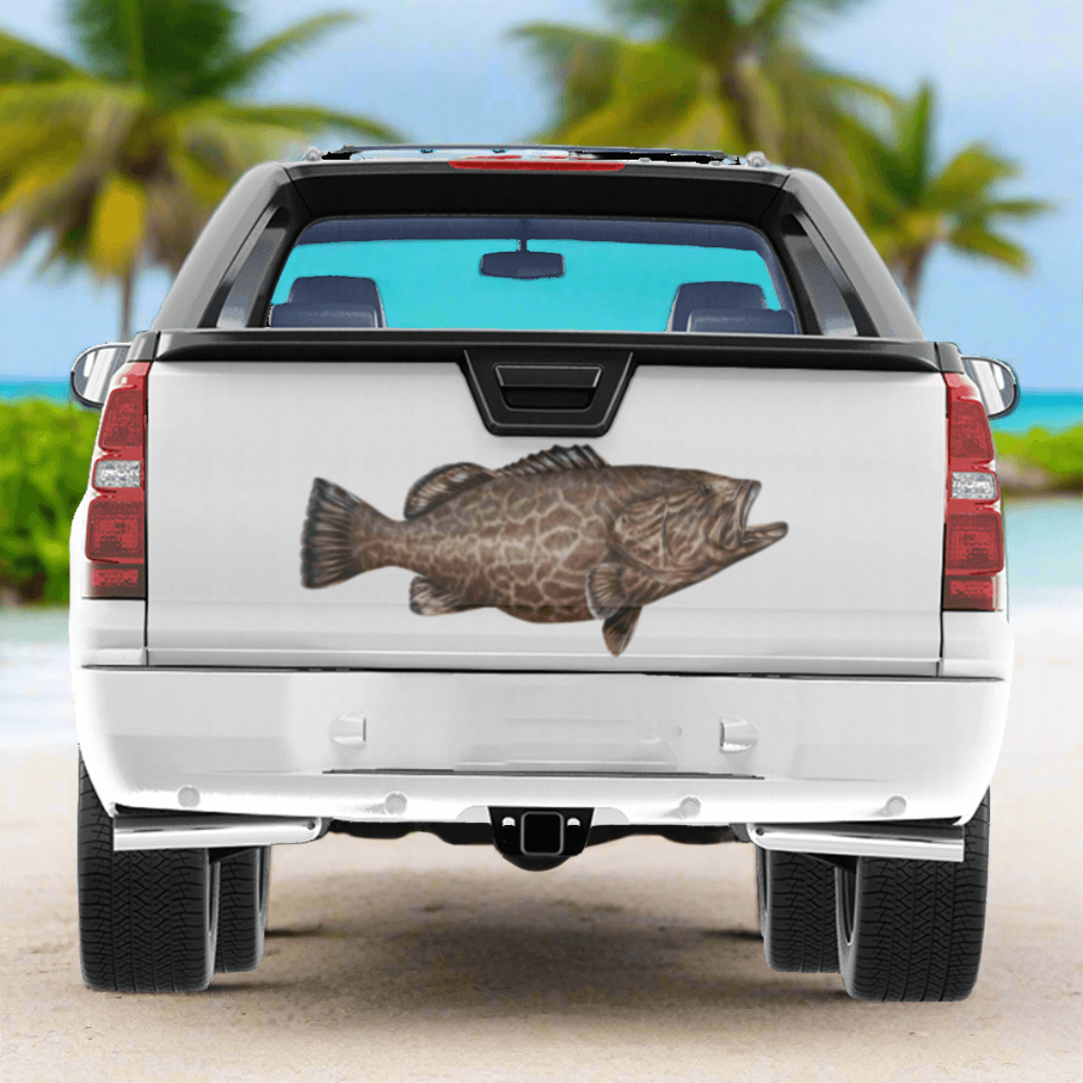 Grouper large decals on a pickup truck near a tropical ocean.