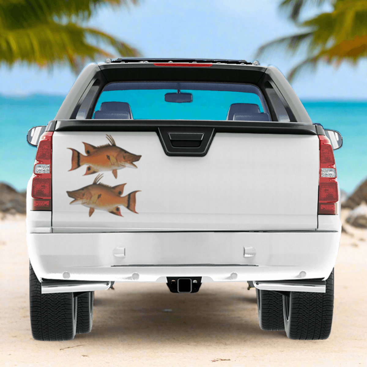 Hogfish large decals on a pickup truck near the ocean.