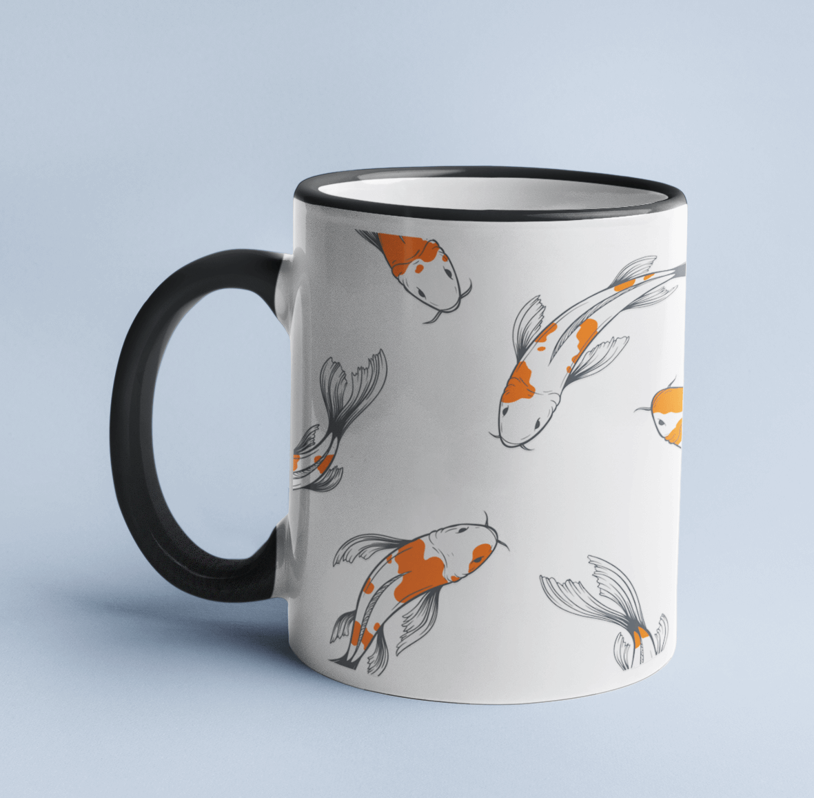 Koi Fish mug on a light blue background, with a light blue handle and rim.