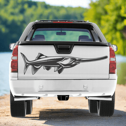 Large Paddlefish decal on a pickup truck by a river.