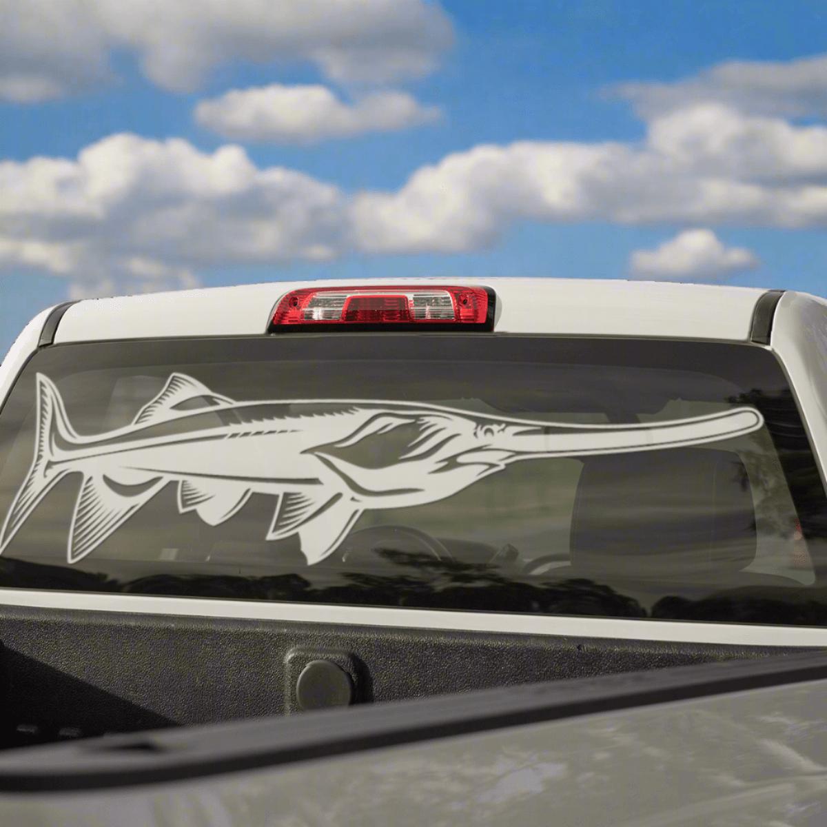 Large Paddlefish decal on a pickup truck rear window.