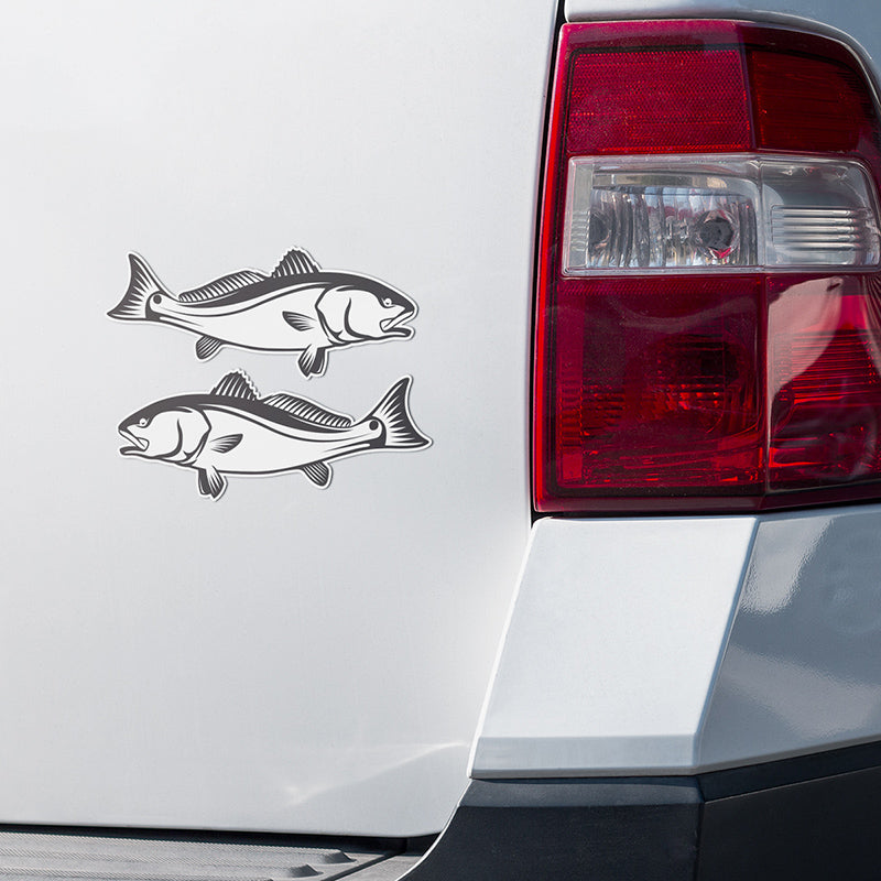 Red Drum Redfish stickers on a white truck.