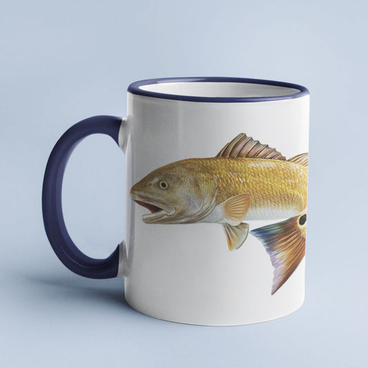 Red Drum accent mug with dark blue handle on light blue background.