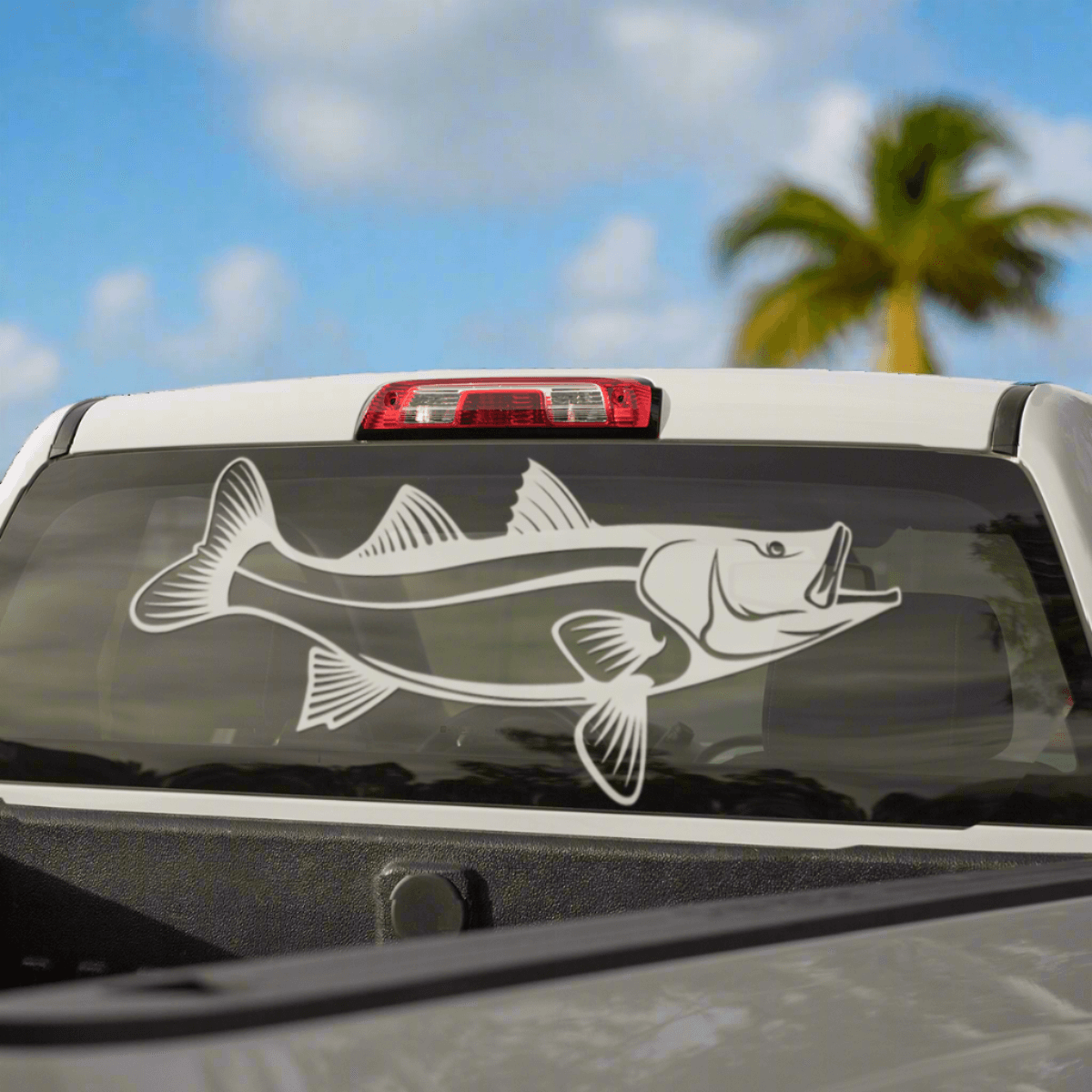 Snook large decal on a pickup truck rear window.