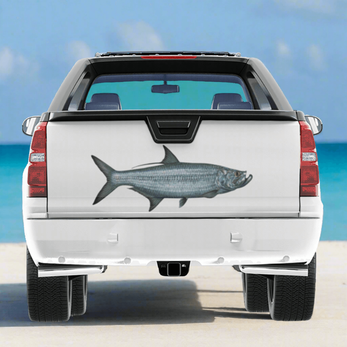 Tarpon large decal on a pickup truck by a blue ocean.