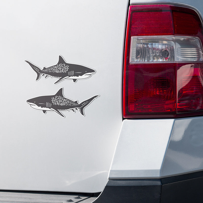 Tiger Shark stickers on a white truck.