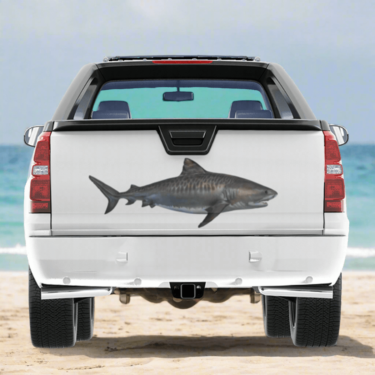 Tiger Shark large decal on a pickup truck by the ocean.