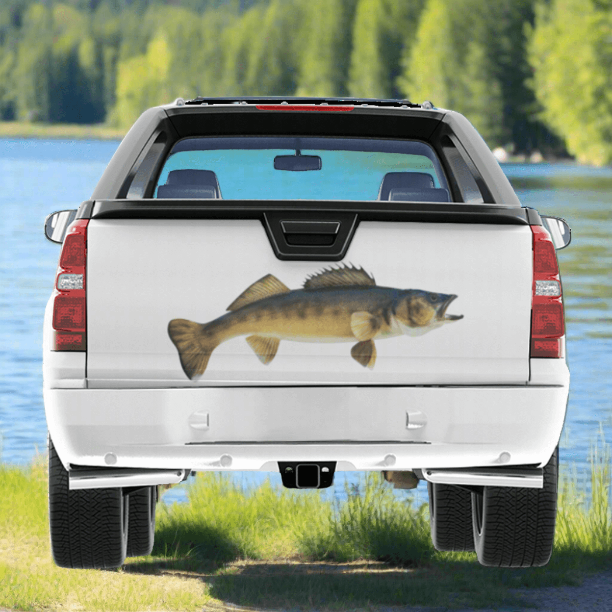 Walleye large decal on a pickup truck parked by a blue river.