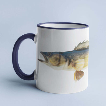 Ceramic coffee mug with a fish illustration on a light blue background.