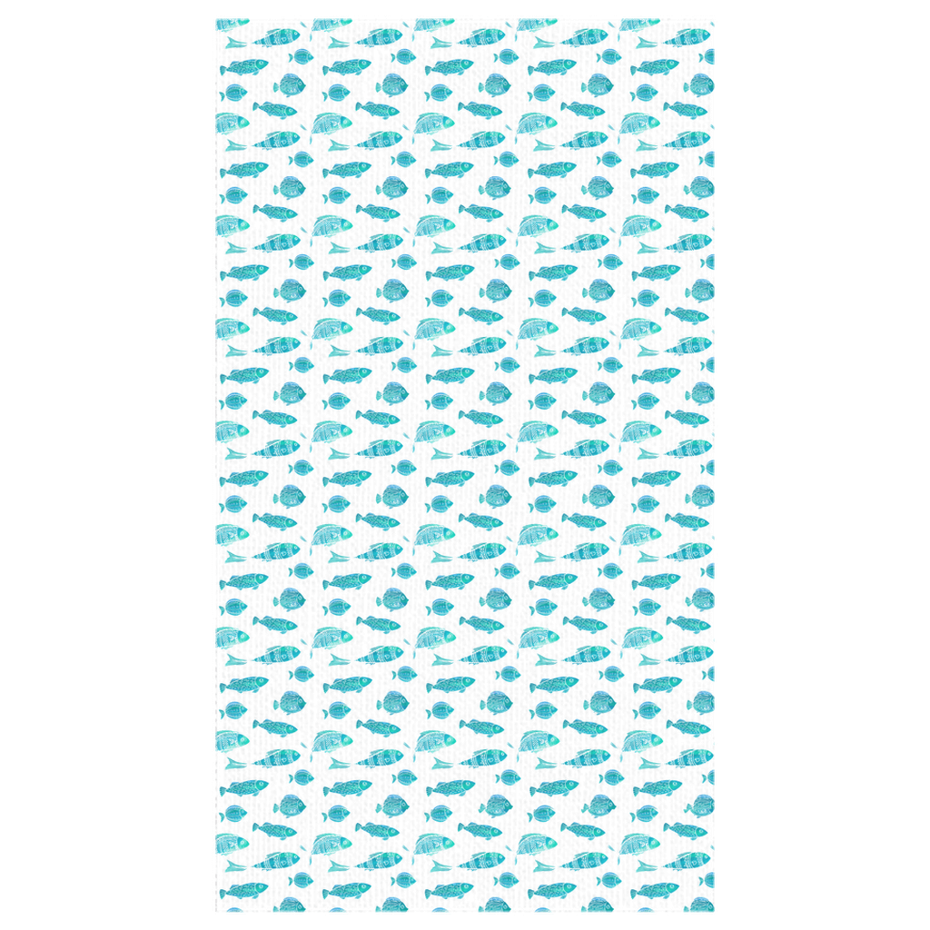 Watercolor blue green fish tablecloth adding aquatic flair to a dining or outdoor table