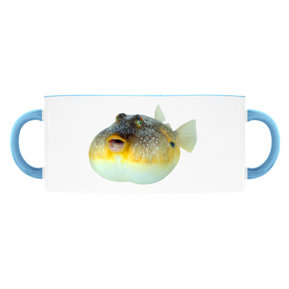 Pufferfish accent mug with light blue handle and rim on white background.