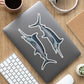 Black Marlin stickers on a laptop.