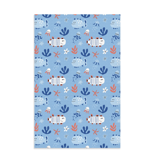 Cute fish dish towel with a playful marine life design on a blue background featuring charming fish and seaweed patterns.