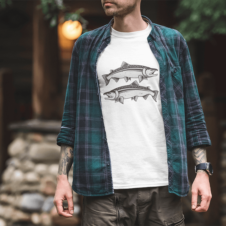 Man wearing white Coho Salmon T-shirt with fish design, overlaid by a green checkered shirt, suitable for fishing or casual wear.