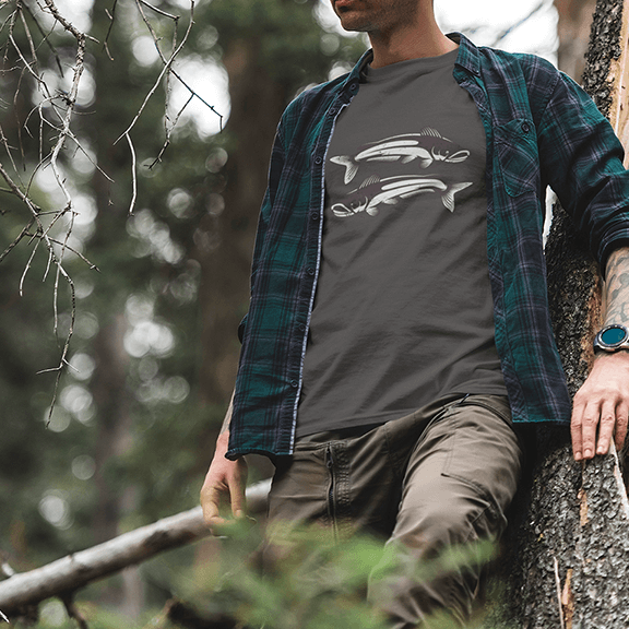 Man wearing a Catfish T-Shirt in the woods.