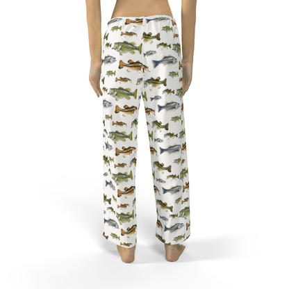 Woman wearing pajama pants with fish print design, showcasing a back view of colorful aquatic pattern.