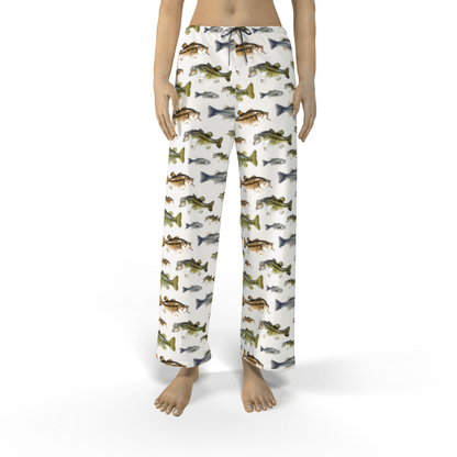 Woman wearing drawstring pants with colorful fish pattern design.