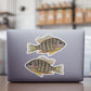 Pumpkindeed Sunfish stickers on a laptop.