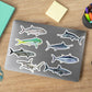 Saltwater gamefish stickers on a laptop.
