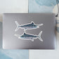 Striped Marlin stickers on a laptop.