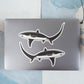 Thresher Shark stickers on a laptop.